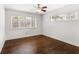 Bright bedroom features hardwood floors, trim work, and a window offering natural light, creating a clean, bright and inviting space at 115 Biscayne Nw Dr # F1, Atlanta, GA 30309