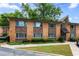 Charming brick apartment building with well-maintained landscaping and manicured lawn at 115 Biscayne Nw Dr # F1, Atlanta, GA 30309