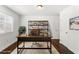 Well-lit home office featuring hardwood floors, large window, and desk, offering a comfortable and productive workspace at 115 Biscayne Nw Dr # F1, Atlanta, GA 30309