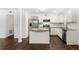 This kitchen has stainless steel appliances, granite countertops, and an island at 115 Biscayne Nw Dr # F1, Atlanta, GA 30309
