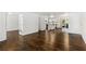 Open-concept living space featuring hardwood floors, a modern kitchen, and access to an outdoor patio at 115 Biscayne Nw Dr # F1, Atlanta, GA 30309