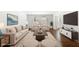 Bright living room features hardwood floors, plush seating, stylish decor, and a flat-screen TV at 115 Biscayne Nw Dr # F1, Atlanta, GA 30309