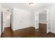 Well-lit living room with beautiful hardwood floors and ample space with open French doors at 115 Biscayne Nw Dr # F1, Atlanta, GA 30309