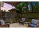 Private patio with cozy seating, offering a relaxing outdoor living space at 115 Biscayne Nw Dr # F1, Atlanta, GA 30309