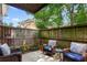 Private patio with cozy seating, offering a relaxing outdoor living space at 115 Biscayne Nw Dr # F1, Atlanta, GA 30309