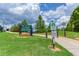 Sign for Bitsy Grant Tennis Center, featuring well-maintained grounds and greenery at 115 Biscayne Nw Dr # F1, Atlanta, GA 30309