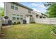 A fenced backyard features a well-maintained lawn, patio area, and a grill, creating an ideal space for outdoor gatherings at 2860 Cooper Brook Dr, Snellville, GA 30078