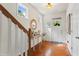 Welcoming entryway showcasing hardwood floors, a staircase, and stylish decor at 2860 Cooper Brook Dr, Snellville, GA 30078
