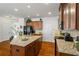 Well-equipped kitchen featuring granite countertops, an island, and ample cabinet space at 2860 Cooper Brook Dr, Snellville, GA 30078
