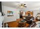 Open-concept living room with hardwood floors, fireplace, and easy access to dining and kitchen at 2860 Cooper Brook Dr, Snellville, GA 30078