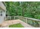 Wood deck offers scenic views of the surrounding lush greenery at 4000 Mcpherson Drive Dr, Acworth, GA 30101