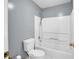 Clean bathroom featuring a shower-tub combo with white tiling at 4000 Mcpherson Drive Dr, Acworth, GA 30101
