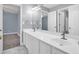 Primary bathroom with double sink vanity and a large, well-lit mirror at 4000 Mcpherson Drive Dr, Acworth, GA 30101
