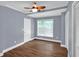Bedroom with hardwood floors, crown molding, ceiling fan, and natural light at 4000 Mcpherson Drive Dr, Acworth, GA 30101