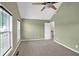 Comfortable bedroom with large windows and neutral tones, providing a blank canvas for personal decoration at 4000 Mcpherson Drive Dr, Acworth, GA 30101