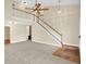 Spacious living room featuring high ceilings, a staircase with white railings, and neutral carpeting at 4000 Mcpherson Drive Dr, Acworth, GA 30101