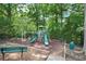 A playground with slides and swings in a wooded area offers an active lifestyle at 4000 Mcpherson Drive Dr, Acworth, GA 30101