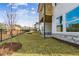A spacious backyard featuring a newly built white two-story home and black fencing at 4480 Beechnut Cir, Cumming, GA 30028