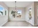 Bright dining room featuring large windows and a stylish chandelier at 4480 Beechnut Cir, Cumming, GA 30028