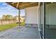 The covered patio has a stone foundation and concrete floors, with sliding glass doors offering easy access to the indoors at 4480 Beechnut Cir, Cumming, GA 30028