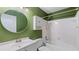 Bathroom featuring a white vanity, medicine cabinet, toilet, and tiled shower/tub at 47 Arbor End, Smyrna, GA 30080