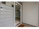 Close up exterior of a condo's entry door with a Ring doorbell and light gray vinyl siding at 47 Arbor End, Smyrna, GA 30080