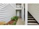 The entrance features modern stairs leading to the upper units at 47 Arbor End, Smyrna, GA 30080