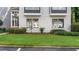 Charming exterior of a two-story condo with well-maintained lawn and landscaping at 47 Arbor End, Smyrna, GA 30080