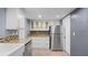 Modern kitchen with shaker cabinets, stainless steel appliances, and beautiful countertops at 47 Arbor End, Smyrna, GA 30080