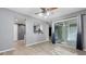 Living room view featuring wood-look floors, sliding door to balcony, open to kitchen with breakfast bar at 47 Arbor End, Smyrna, GA 30080