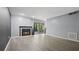 Bright living room with new floors, cozy fireplace, and sliding glass door to the outside at 47 Arbor End, Smyrna, GA 30080