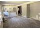 Bright, spacious living room with a modern kitchen featuring white cabinets and a center island at 1968 Rosewood Rd, Decatur, GA 30032
