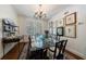 Charming dining room boasting a glass table, chandelier, and decorative artwork creating an elegant ambiance at 2260 Peachtree Nw Rd # B4, Atlanta, GA 30309