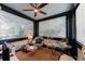 Charming sunroom with large windows, natural light, a ceiling fan, and a cozy seating area at 2260 Peachtree Nw Rd # B4, Atlanta, GA 30309