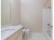 A bright bathroom features a vanity with marble countertops and a shower/tub combo at 2883 Thurleston Ln, Duluth, GA 30097