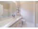 Clean bathroom with modern sink, vanity, mirror, white tile floors, and updated fixtures at 2883 Thurleston Ln, Duluth, GA 30097