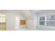 Finished bedroom with neutral carpet and paint, large windows, and walk-in closet at 2883 Thurleston Ln, Duluth, GA 30097