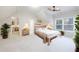 Light bedroom featuring contemporary decor and an en-suite bathroom, adding convenience at 2883 Thurleston Ln, Duluth, GA 30097