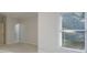 The bedroom has plush carpet, neutral walls, and an open door leading to other parts of the house at 2883 Thurleston Ln, Duluth, GA 30097