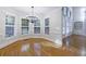 Bright breakfast nook with hardwood floors, chandelier, and multiple windows at 2883 Thurleston Ln, Duluth, GA 30097