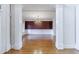Elegant dining room with hardwood floors, chandelier, wainscoting, and rich accent wall at 2883 Thurleston Ln, Duluth, GA 30097
