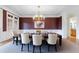 Elegant dining room with wainscoting, decorative lighting, and a neutral color palette at 2883 Thurleston Ln, Duluth, GA 30097