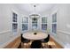 Cozy dining room featuring a round table, modern chairs, and bay windows at 2883 Thurleston Ln, Duluth, GA 30097
