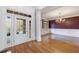 Inviting entryway featuring hardwood floors, sidelight windows, chandelier, and grand pillars at 2883 Thurleston Ln, Duluth, GA 30097