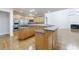 Spacious kitchen features hardwood floors, stainless steel appliances, and granite countertops at 2883 Thurleston Ln, Duluth, GA 30097