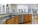 Classic kitchen featuring wood cabinets, stainless steel appliances, granite countertops, and a bay window at 2883 Thurleston Ln, Duluth, GA 30097