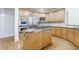 Kitchen with stainless steel appliances, wood cabinets, and granite countertops at 2883 Thurleston Ln, Duluth, GA 30097