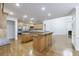Spacious kitchen features hardwood floors, stainless steel appliances, and granite countertops at 2883 Thurleston Ln, Duluth, GA 30097