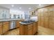 Traditional eat-in kitchen featuring stainless steel appliances, wood cabinets, and central island with gas stovetop at 2883 Thurleston Ln, Duluth, GA 30097