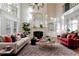 Spacious living room with fireplace, bookshelf, comfortable seating, and lots of natural light at 2883 Thurleston Ln, Duluth, GA 30097